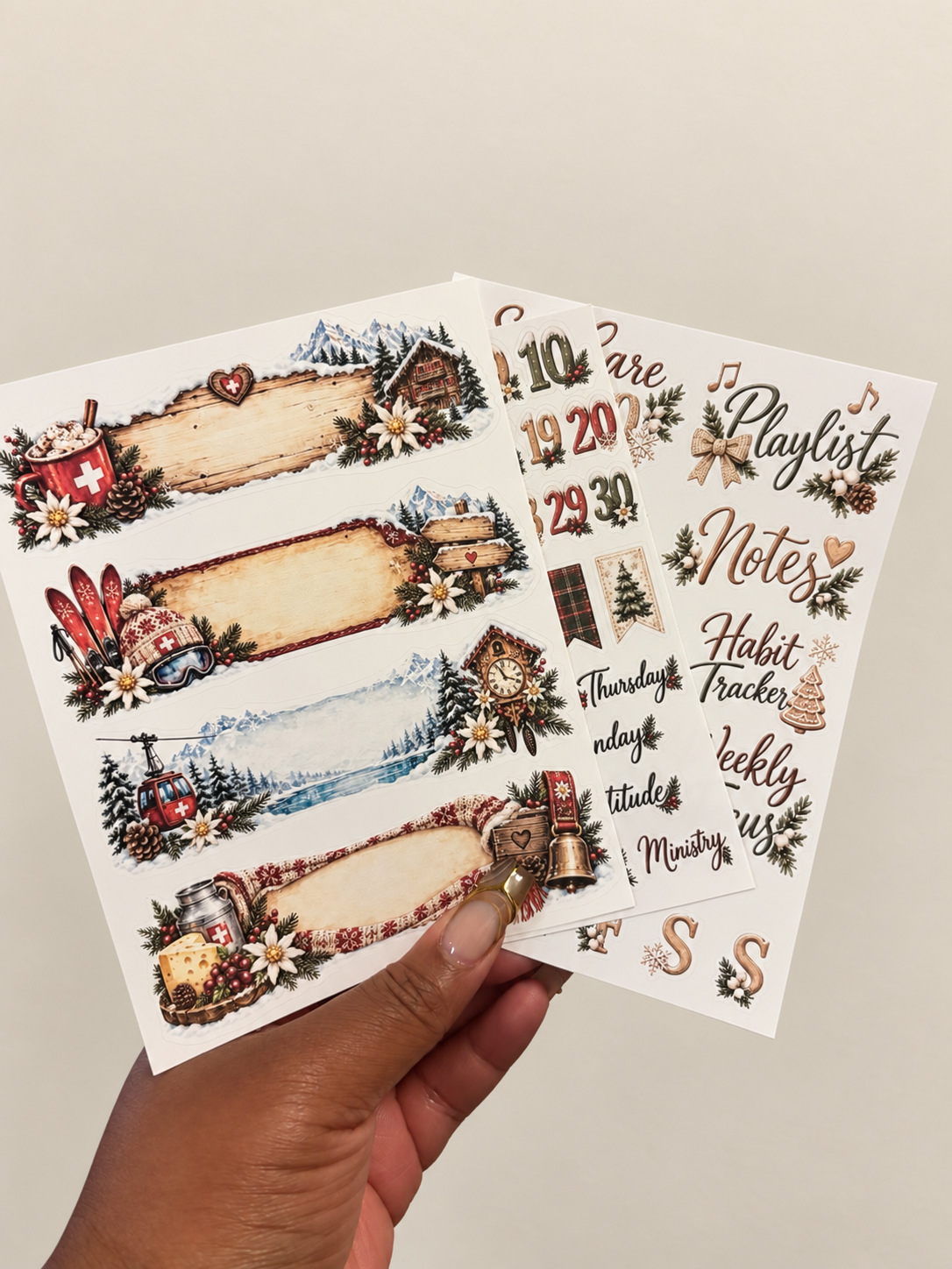 Winter Wonderland Basic three-sheet planner sticker set with snowy chalets, evergreen branches, and cozy winter decorations.
